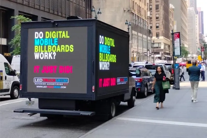 Truck with a mobile digital billboard on a city street