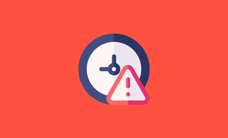 Icon of a clock with a warning sign