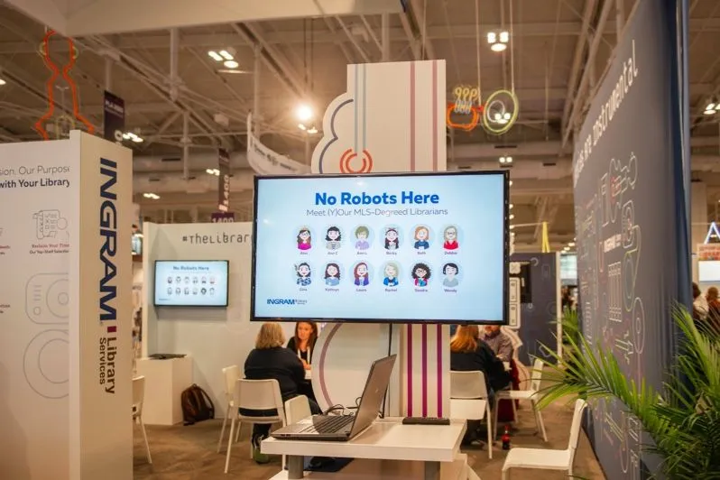 Exhibition booth with a large display screen