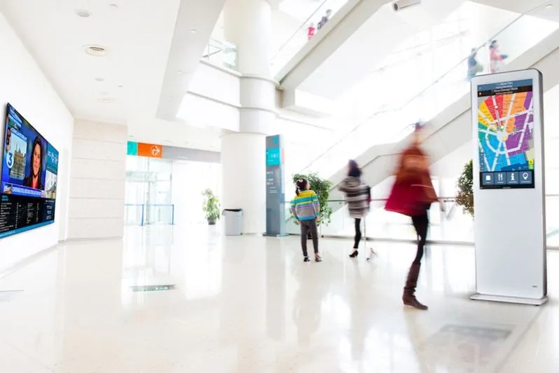 Bright hospital lobby with an information kiosk