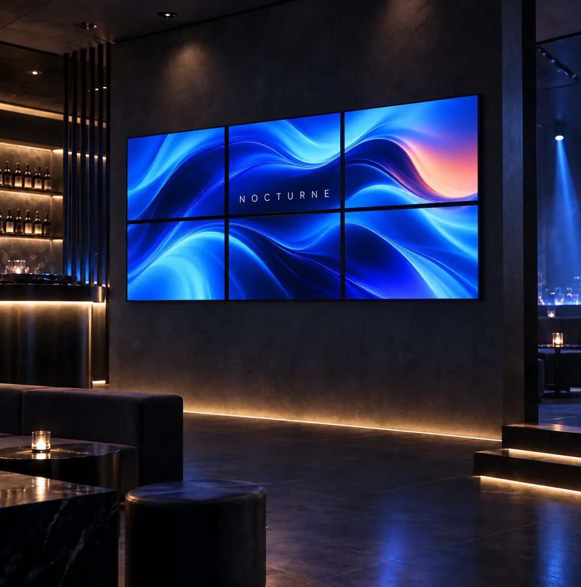Video wall of six screens with blue waves in a dark lounge
