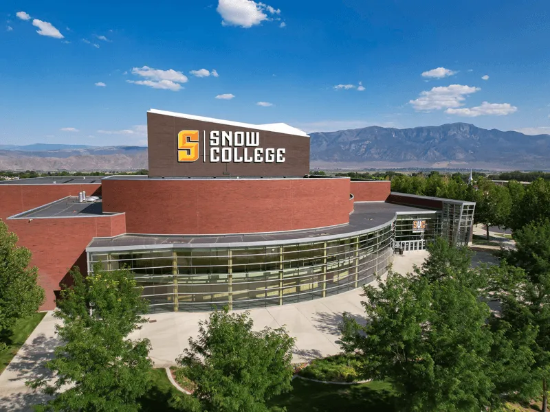 Snow College building with mountains behind it