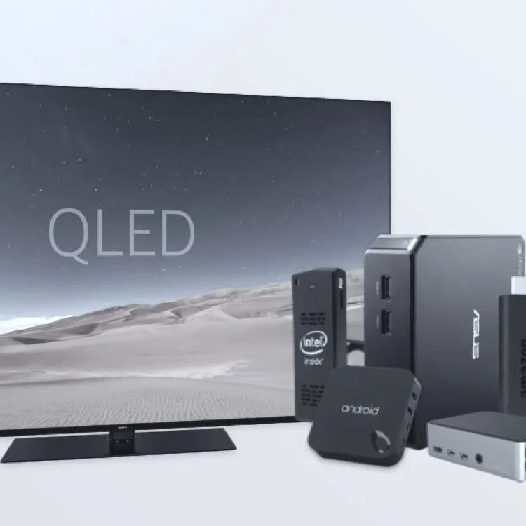 A Smart TV next to several small media players
