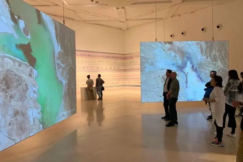 The exhibition at Triennale di Milano featuring digital signage