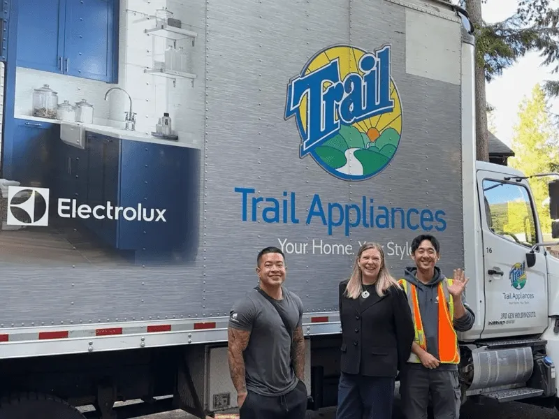 Trail Appliances team in front of a delivery truck
